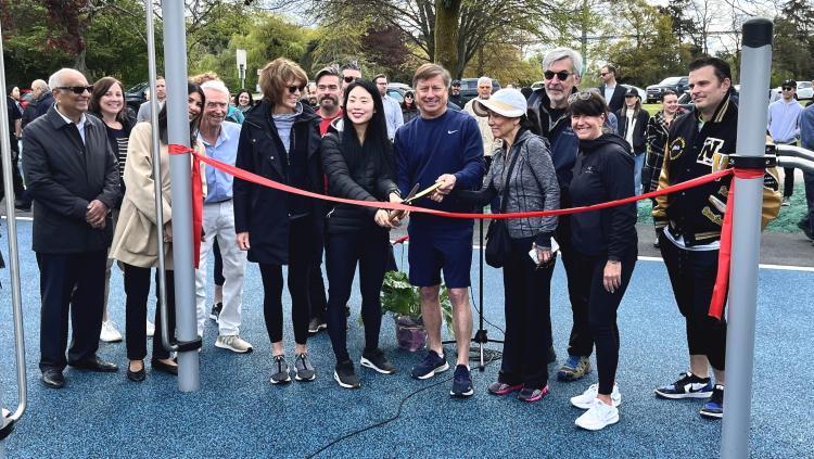 West Vancouver Mayor, members of Council, and community supporters prepare to cut the ribbon and open the Keen Lau Fitness Circuit