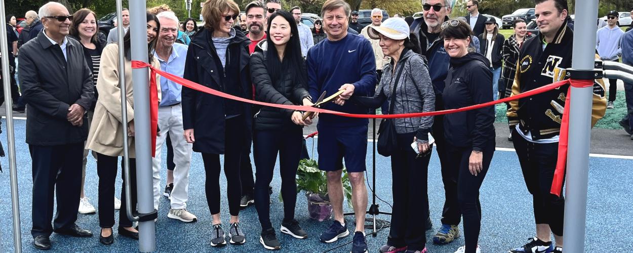 West Vancouver Mayor, members of Council, and community supporters prepare to cut the ribbon and open the Keen Lau Fitness Circuit