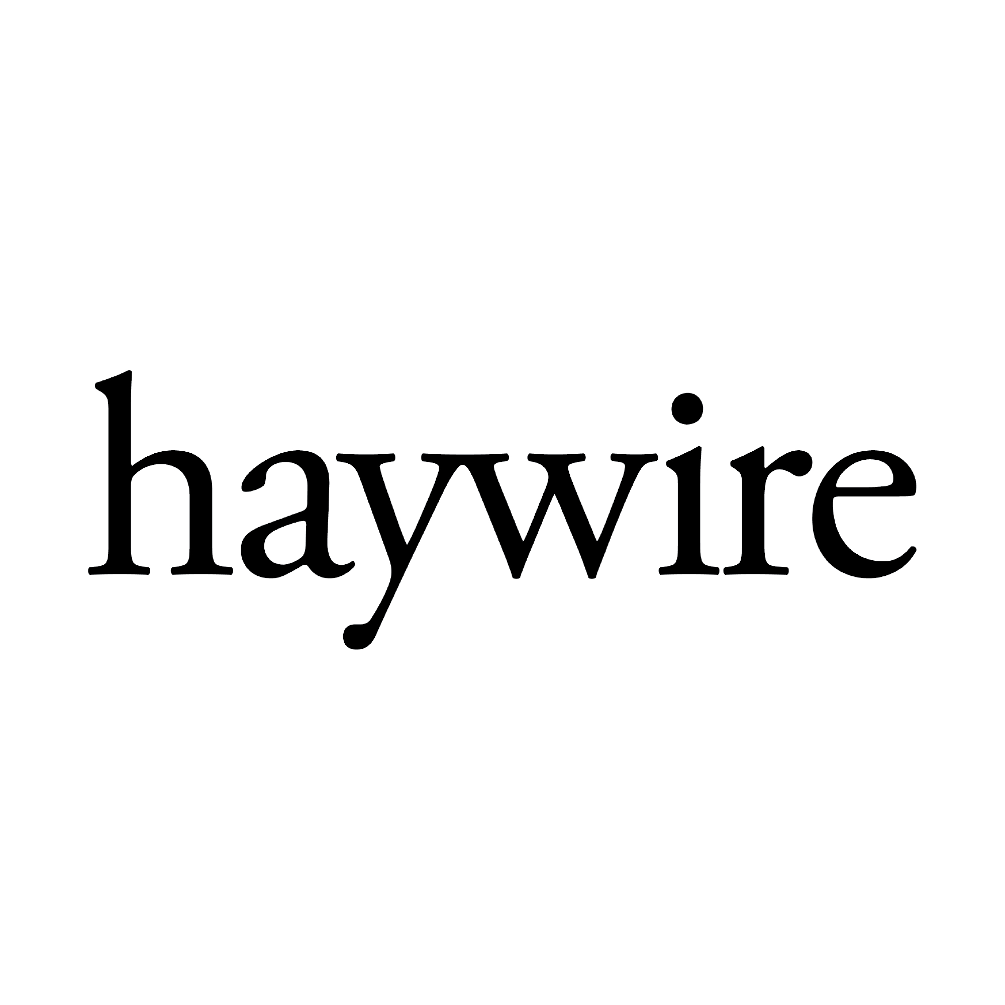 The image features a white rectangular sign displaying the word "haywire" in black text. It emphasizes the typography and graphic design elements, showcasing a clean and simple layout. The use of contrasting colors highlights the message effectively.