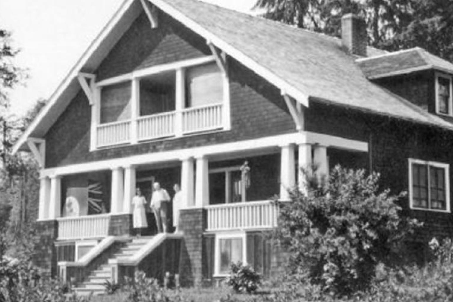 Exterior of house with people on porch