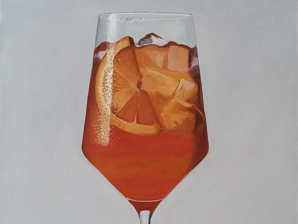 The image is a close-up, realistic painting of a tall glass of orange-colored liquid with ice and an orange slice. The glass is filled with a vibrant, amber-orange beverage, likely an aperitif like Aperol or Campari, given the color and the addition of an orange slice. Several ice cubes are visible, some partially submerged, catching the light and creating highlights and shadows within the drink. A thick slice of orange, with its characteristic segments and rind, is positioned prominently in the glass, cont