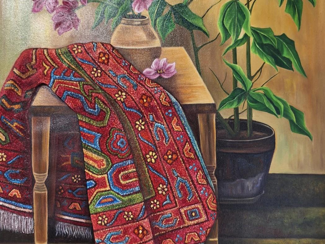 This is a still life painting with a warm, earthy color palette. The dominant colors are rich reds, deep greens, and golden yellows, with accents of blue and purple. The scene is composed with a focus on texture and pattern, creating a sense of depth and tactile richness.