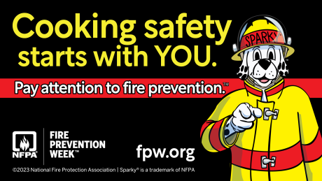 Fire Prevention Week banner featuring an illustration of Sparky, the Dalmatian mascot, wearing a firefighter's uniform. Text reads: "Cooking safety starts with YOU. Pay attention to fire prevention." FPW.org